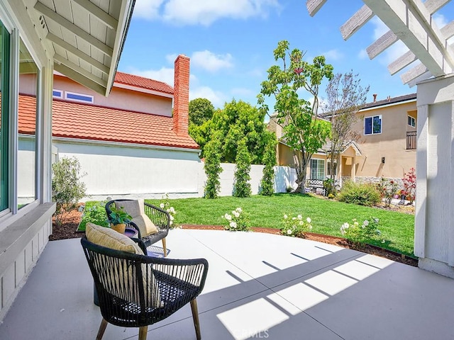 view of patio / terrace featuring fence