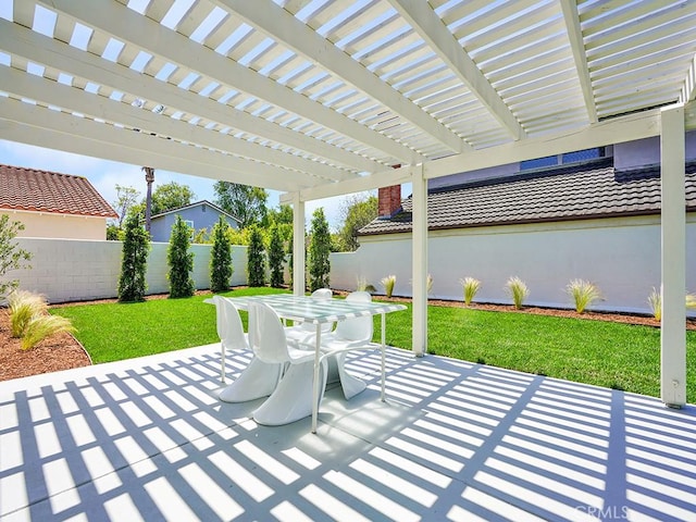 view of patio / terrace with a pergola, fence, and outdoor dining space