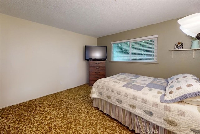 carpeted bedroom with a textured ceiling