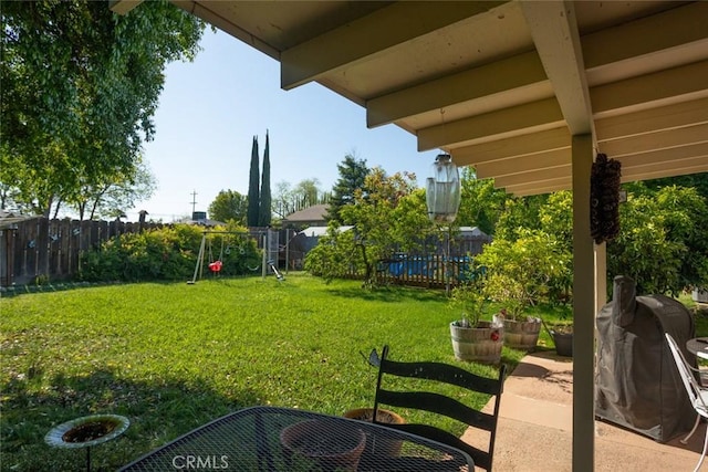 view of yard with a fenced backyard and a patio area