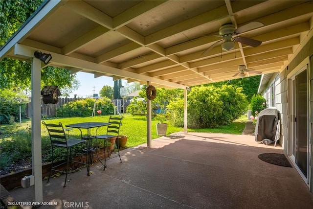 view of patio / terrace featuring a fenced backyard, a ceiling fan, outdoor dining space, and grilling area