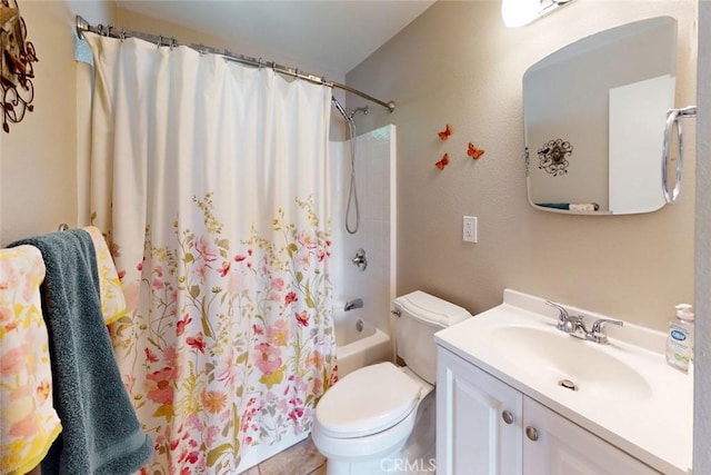 full bathroom featuring toilet, shower / bathtub combination with curtain, and vanity