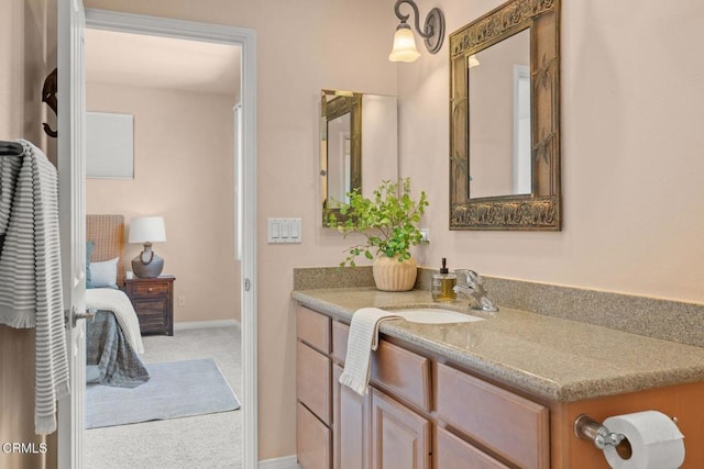 bathroom with vanity and baseboards