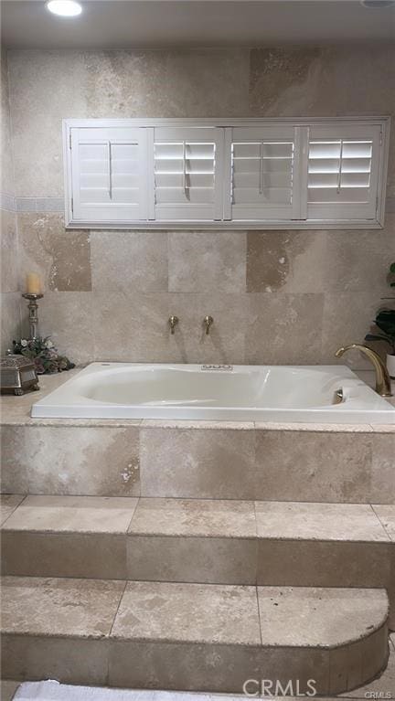 2285 W 2nd Ave, San Bernardino, CA 92407 - bathroom with a bath and tile walls
