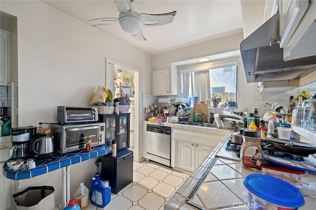 10139 Hayvenhurst Ave, North Hills, CA 91343 - kitchen featuring tile counters, dishwasher, under cabinet range hood, and white cabinets