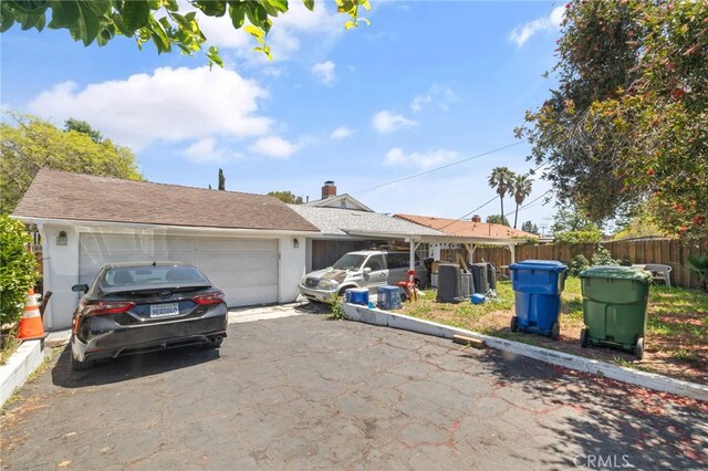 10139 Hayvenhurst Ave, North Hills, CA 91343 - ranch-style home featuring fence, driveway, and a garage