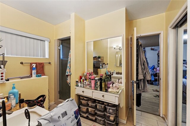 10139 Hayvenhurst Ave, North Hills, CA 91343 - full bathroom featuring tile patterned floors and a shower with door