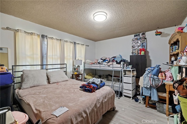 10139 Hayvenhurst Ave, North Hills, CA 91343 - bedroom featuring a textured ceiling and wood finished floors