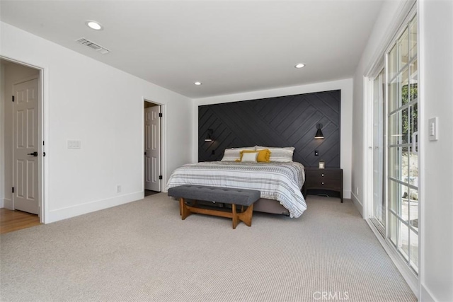 bedroom with carpet floors, recessed lighting, baseboards, and visible vents
