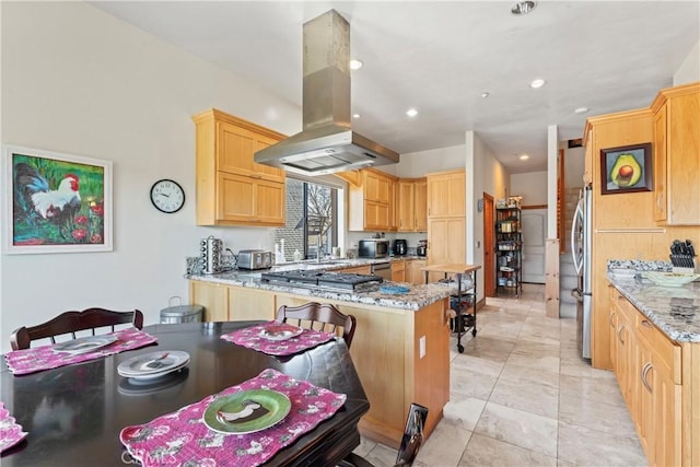 1305 Montreal Dr, Lake Arrowhead, CA 92352 - kitchen featuring island range hood, light stone counters, a peninsula, stainless steel appliances, and recessed lighting