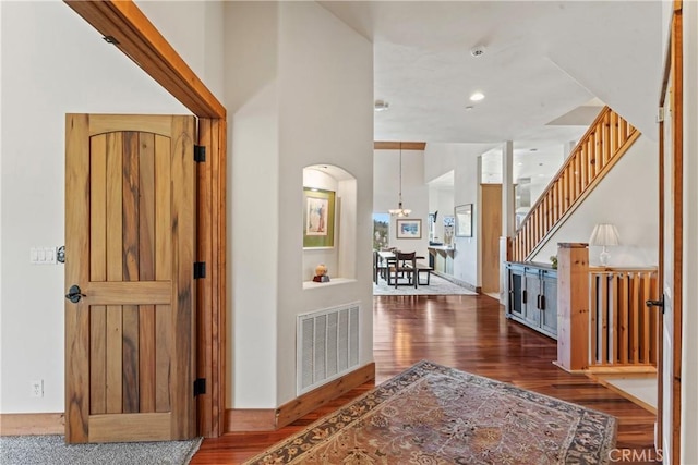 1305 Montreal Dr, Lake Arrowhead, CA 92352 - entrance foyer featuring stairway, wood finished floors, and visible vents