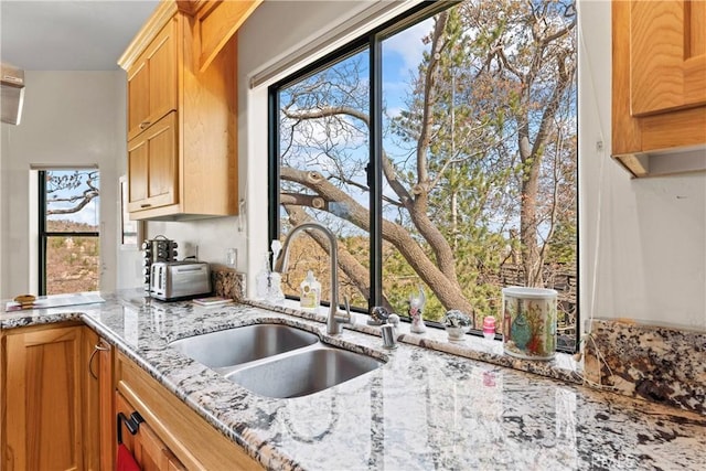 1305 Montreal Dr, Lake Arrowhead, CA 92352 - kitchen featuring light stone countertops, a sink, and a toaster