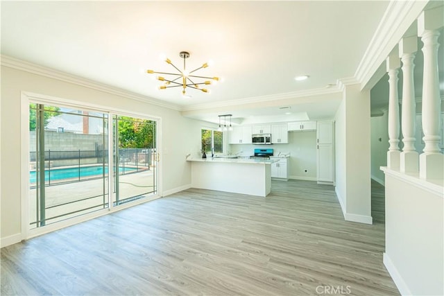 unfurnished living room featuring crown molding, baseboards, recessed lighting, a chandelier, and light wood finished floors