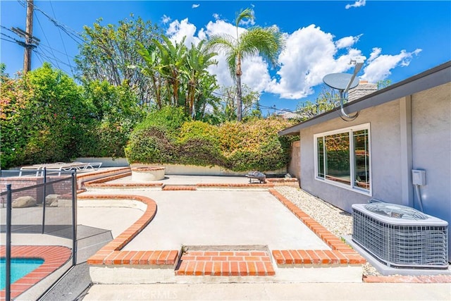 view of patio with central AC