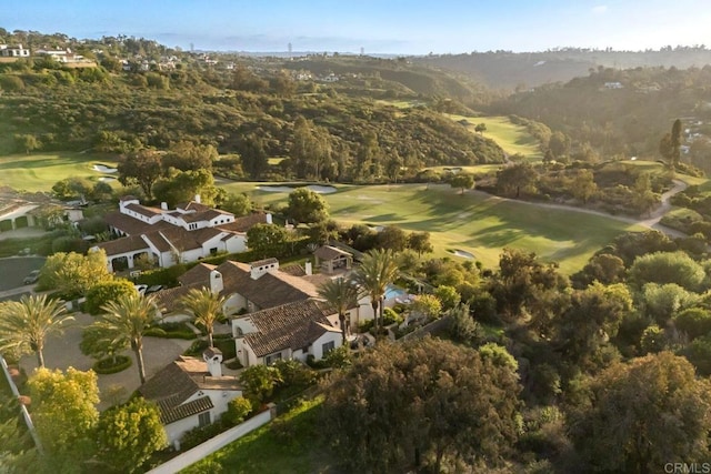 drone / aerial view with golf course view and a residential view