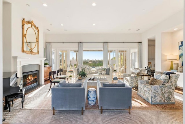 carpeted living room with recessed lighting, a glass covered fireplace, and a healthy amount of sunlight
