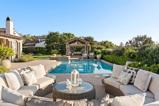 pool featuring a gazebo, an outdoor living space, and a patio area