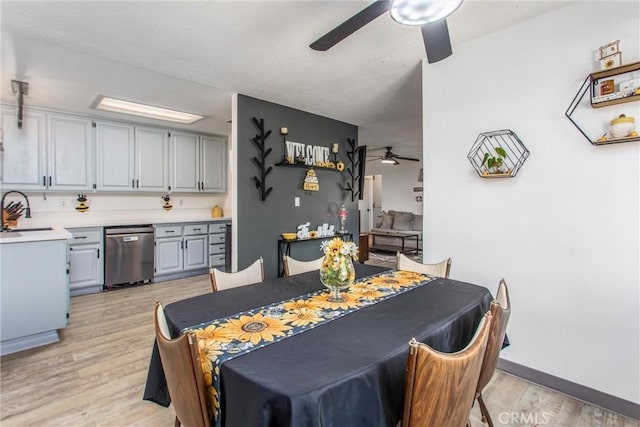 dining room featuring light wood-style floors and ceiling fan