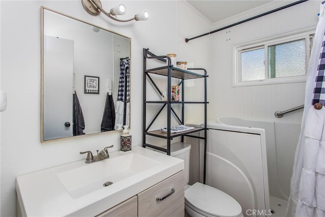 bathroom with vanity, toilet, and curtained shower