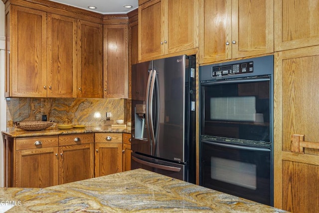 1954 Primrose Ave, South Pasadena, CA 91030 - kitchen with stainless steel refrigerator with ice dispenser, light stone counters, and brown cabinets