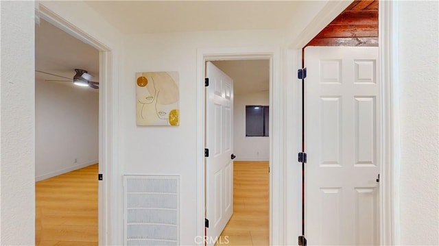 corridor with light wood-style flooring