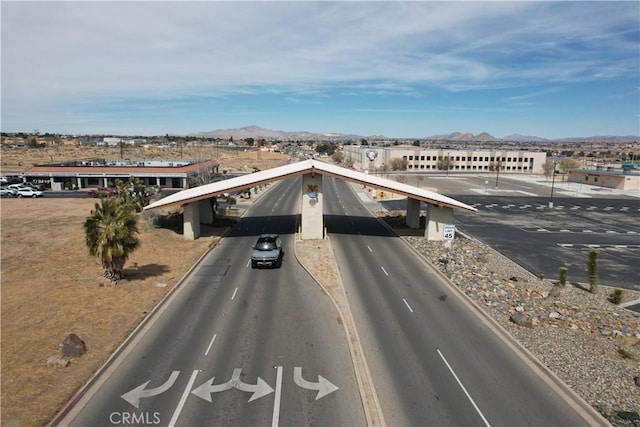 view of asphalt street featuring a mountain view