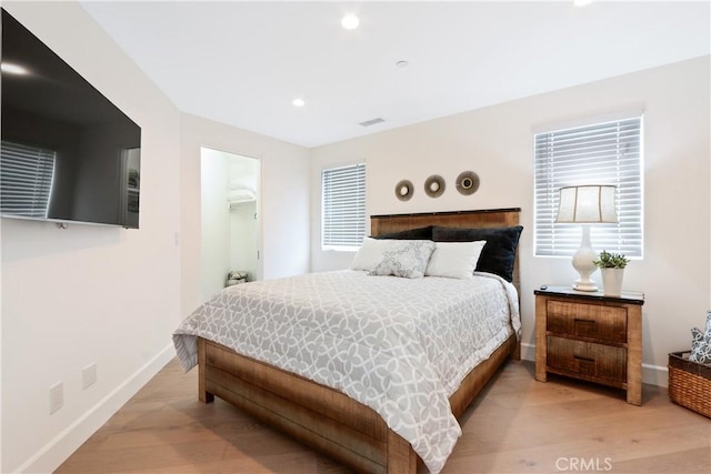 bedroom featuring recessed lighting, baseboards, visible vents, and light wood-type flooring
