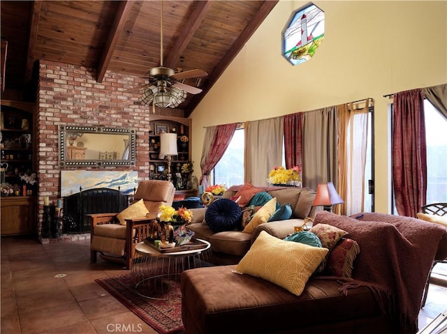 living area with ceiling fan, a brick fireplace, high vaulted ceiling, wooden ceiling, and beamed ceiling
