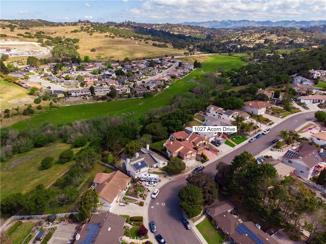 birds eye view of property with a residential view and a mountain view