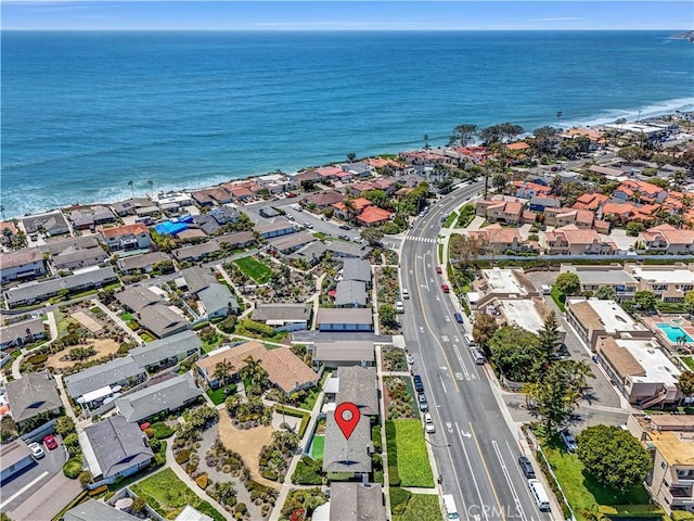 birds eye view of property with a water view and a residential view