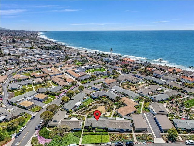 drone / aerial view with a water view and a residential view