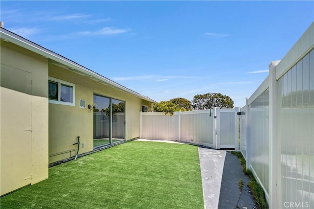 view of yard with a gate and fence