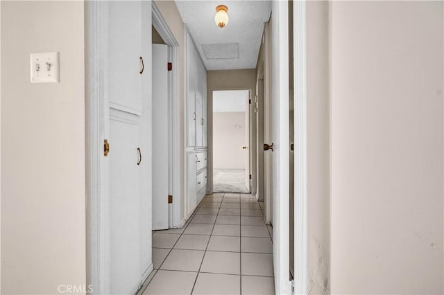 hall with light tile patterned flooring