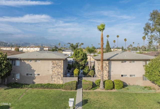 327331 S Steckel Dr, Santa Paula, CA 93060 - view of side of home with fence, a residential view, stucco siding, a mountain view, and a yard