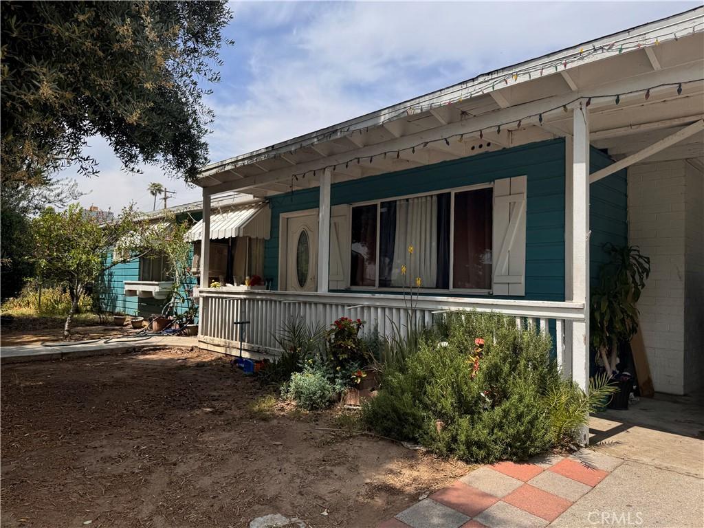6735 Merito Ave, San Bernardino, CA 92404 - view of side of property featuring covered porch