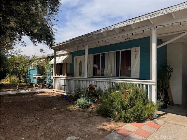 6735 Merito Ave, San Bernardino, CA 92404 - view of side of property featuring covered porch