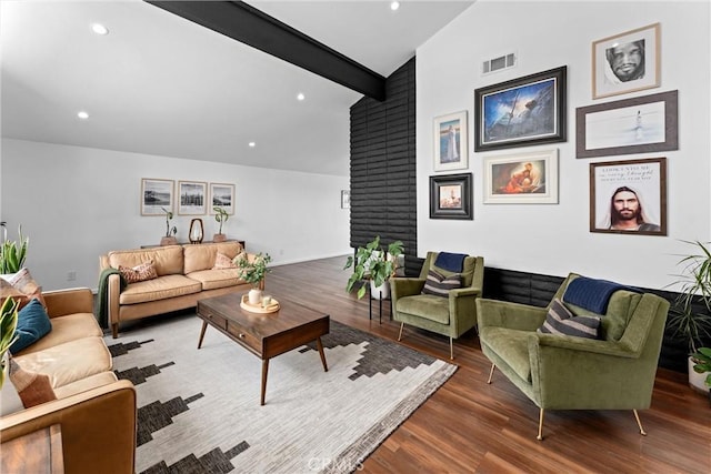 living area featuring visible vents, lofted ceiling with beams, wood finished floors, and recessed lighting