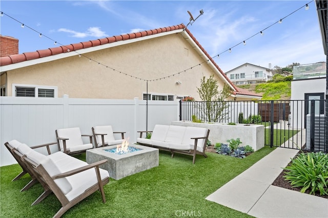 view of patio featuring an outdoor living space with a fire pit, cooling unit, and fence private yard