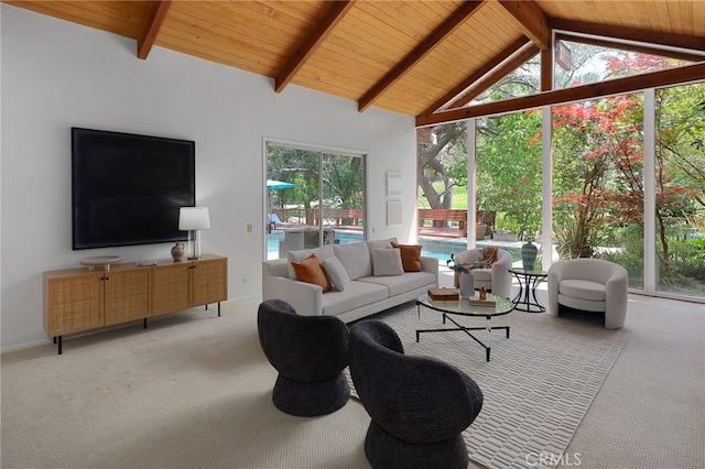 living area featuring wood ceiling, light carpet, and beam ceiling