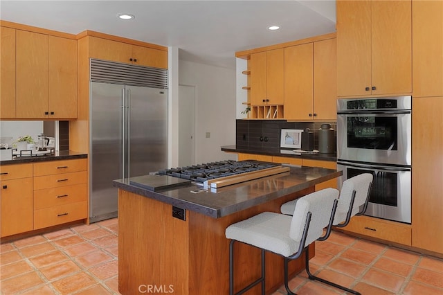 kitchen featuring dark countertops, open shelves, stainless steel appliances, and recessed lighting