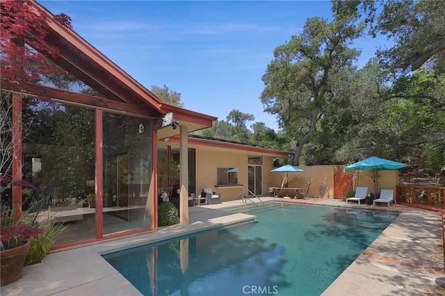 view of pool with a fenced in pool and a patio area