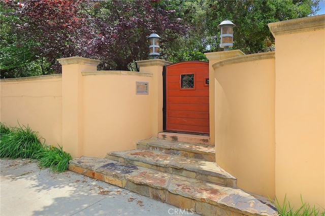 view of gate featuring fence