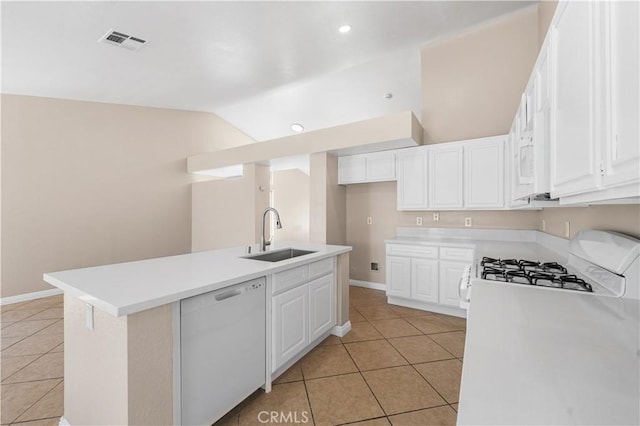 kitchen with visible vents, light tile patterned flooring, white cabinets, a sink, and dishwasher