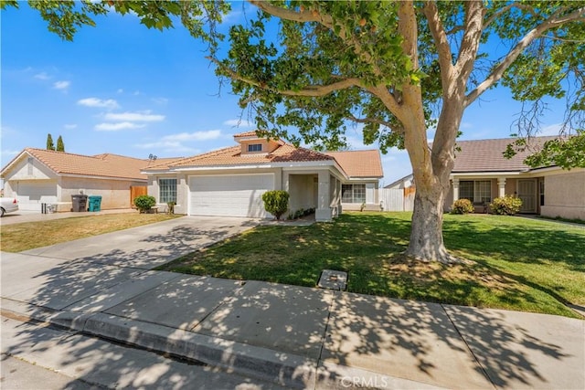 single story home with a tile roof, a garage, stucco siding, a front yard, and concrete driveway