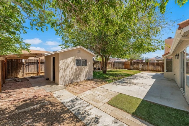 view of outbuilding featuring a fenced backyard and an outdoor structure