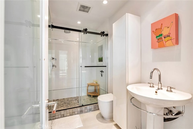 bathroom featuring toilet, visible vents, a shower stall, and recessed lighting
