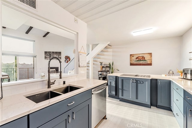 kitchen with stainless steel dishwasher, decorative backsplash, light stone countertops, gray cabinets, and a sink