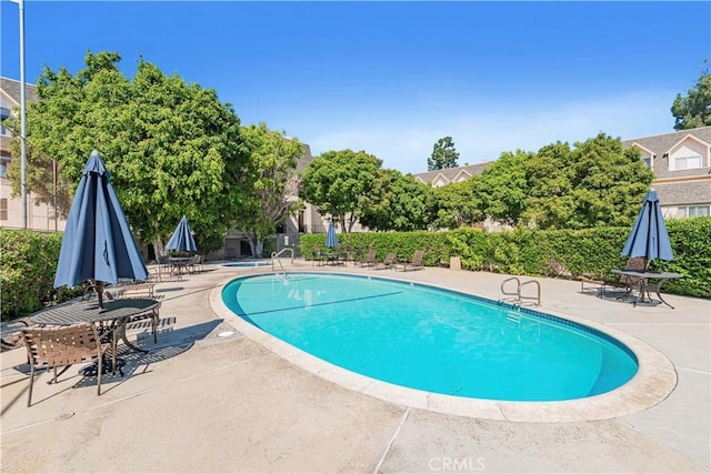 pool with a patio