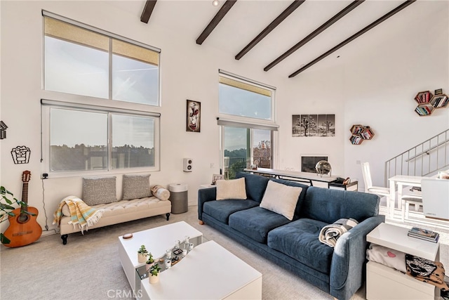 living room with carpet floors, stairs, beam ceiling, and high vaulted ceiling