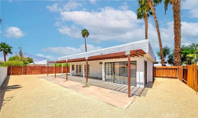 69645 Antonia Way, Rancho Mirage, CA 92270 - back of house with a patio, a mountain view, and a fenced backyard